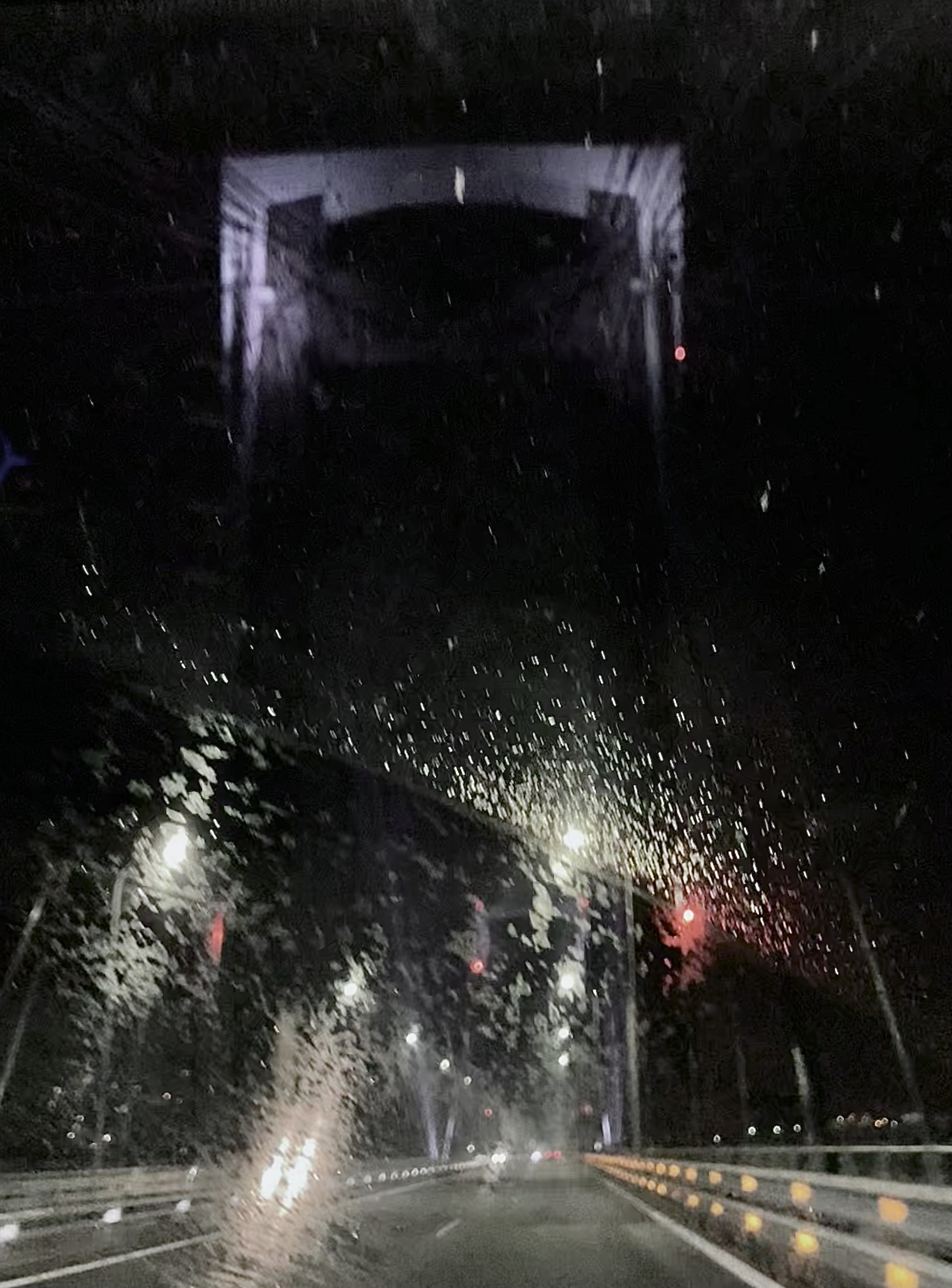 a lit bridge in the dark